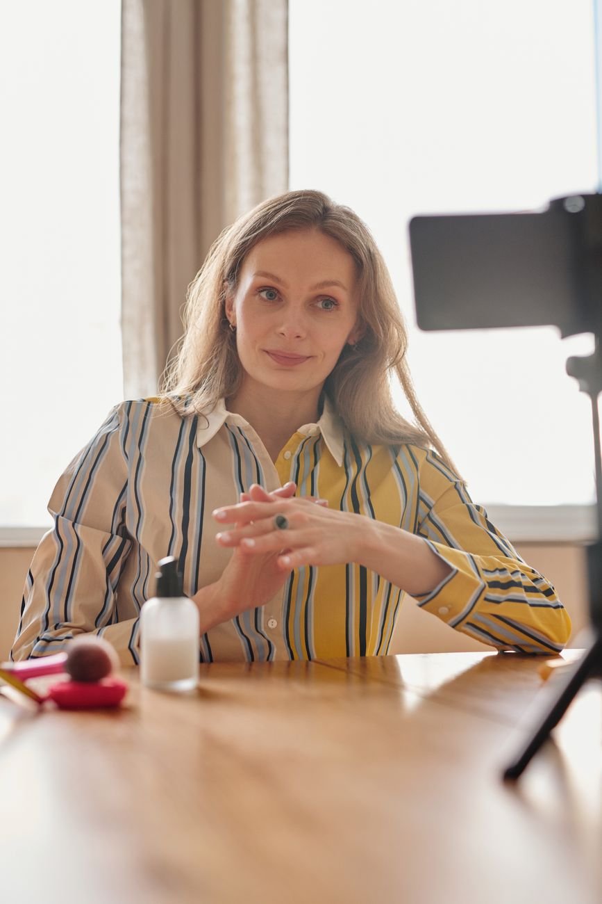 Creator demonstrating beauty products on video in a lifestyle setting